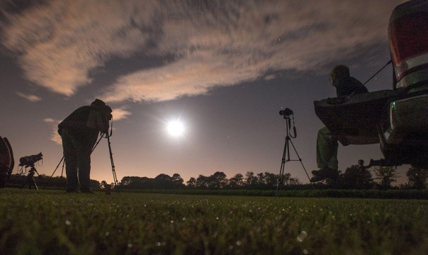 Photographers Chuck Vickers, right, and James Taylor photograph the total lunar eclipse Wednesday morning from a large field south of Wade, NC.