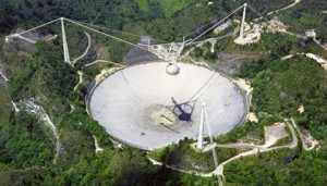  Arecibo 305 m radio telescope, located in a natural valley in Puerto Rico. NAIC 