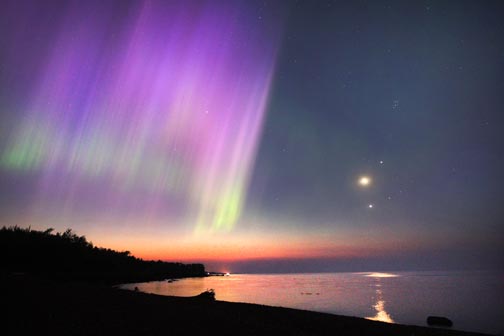 Even dawn couldn't put a stop to this auroral show. 