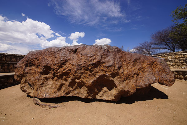 At over 60 tons, and measuring 2.7 meters across, the Hoba Meteorite near Grootfontein, Namibia, is the largest known space rock on the planet.