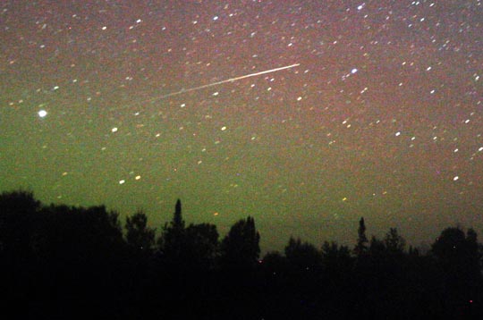 Meteor dusts a glowing sky