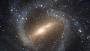 The NASA/ESA Hubble Space Telescope has taken a picture of the barred spiral galaxy NGC 1073, which is found in the constellation of Cetus (The Sea Monster). Our own galaxy, the Milky Way, is a similar barred spiral, and the study of galaxies such as NGC 1073 helps astronomers learn more about our celestial home. The Hubble Space Telescope is a project of international cooperation between ESA and NASA. NASA, ESA