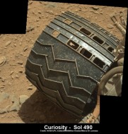 Image of tear in one of Curiosity’s wheels taken on Dec. 22, 2013 NASA/JPL/MSSS/Ken Kremer -kenkremer.com/Marco Di Lorenzo
