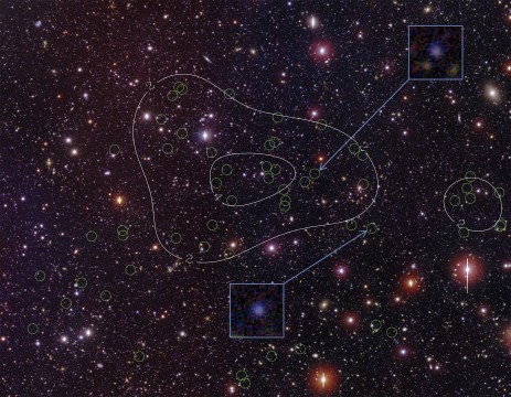 The newly discovered protocluster of galaxies located in the Bootes field of the NOAO Deep Wide-field Survey. The green circles identify the confirmed cluster members. Density contours (white lines) emphasize the concentration of member galaxies toward the center of the image. The inset images highlight two example members that glow in the Ly-alpha line of atomic hydrogen. Dr. Rui Xue, Purdue University