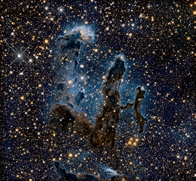 The "Pillars of Creation" inside the Eagle Nebula (M16) seen in the infrared. Our solar system likely formed inside a very similar stellar cocoon. NASA/ESA/STScl/AURA/Hubble Heritage Team. 