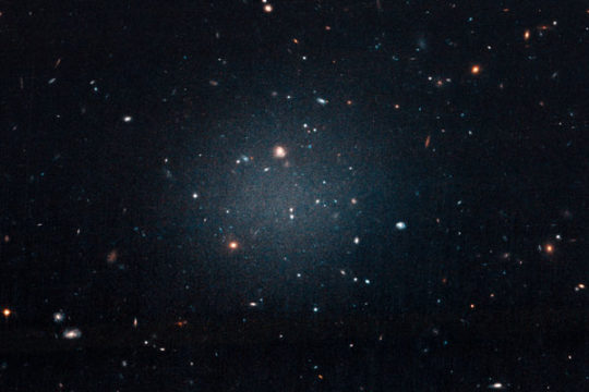 The first dark matter-less galaxy, NGC 1052-DF2