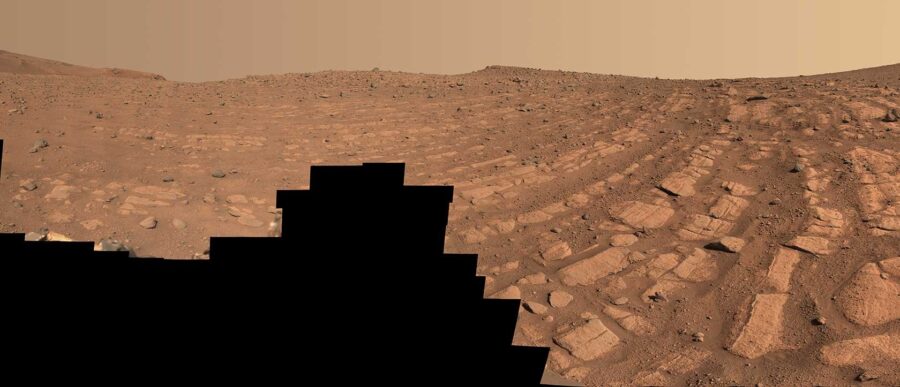 bands of red rocks on a red planet