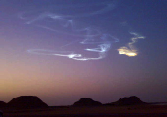 Asteroid smoke train in sky