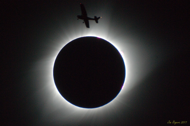 Eclipse silhouetting small plane. Salem, Oregon, 8/21/2017.