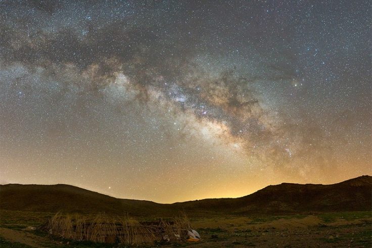 The milky way over a corral on a ranch
