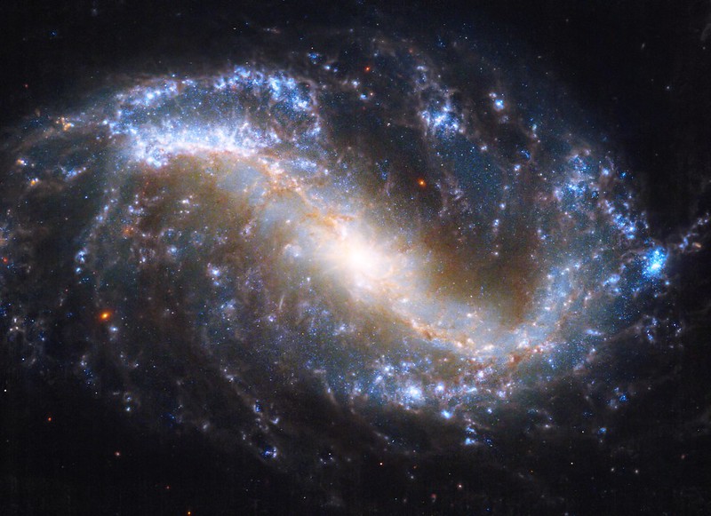 NGC 7496 spiral galaxy seen in visible and infrared wavelengths