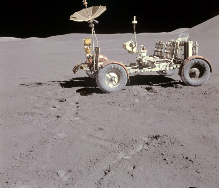 The lunar rover, an open vehicle with four wheels, two seat and a receiver that resembles an upturned umbrella