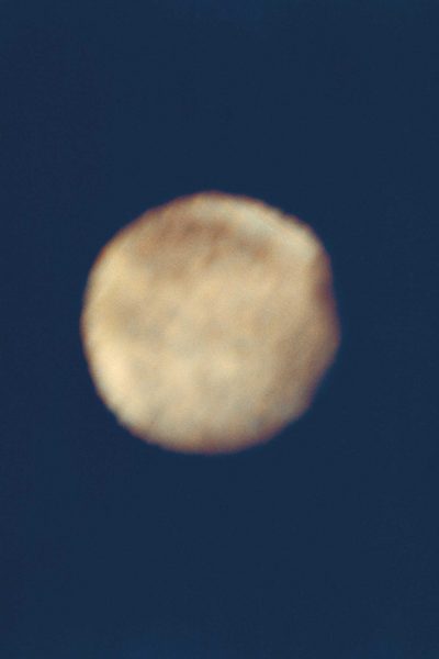 blurry image of Ganymede against blue background