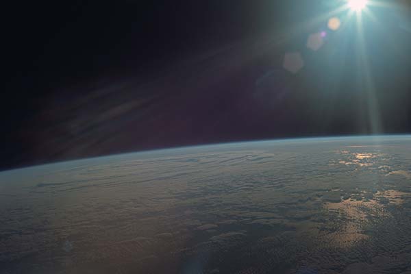 Apollo 11 photo of Earth with glare from Sun