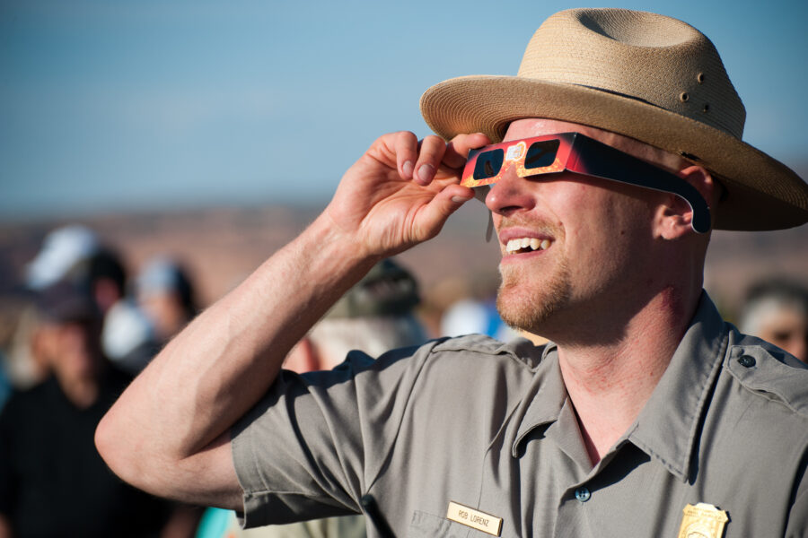 National Park ranger with solar eclipse glasses on 