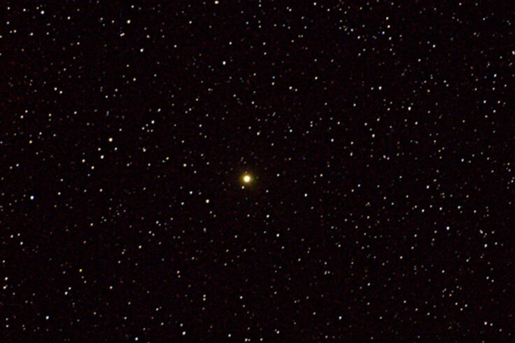 Orange star in star field