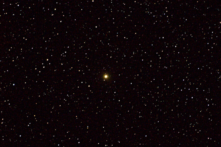 Orange star in star field