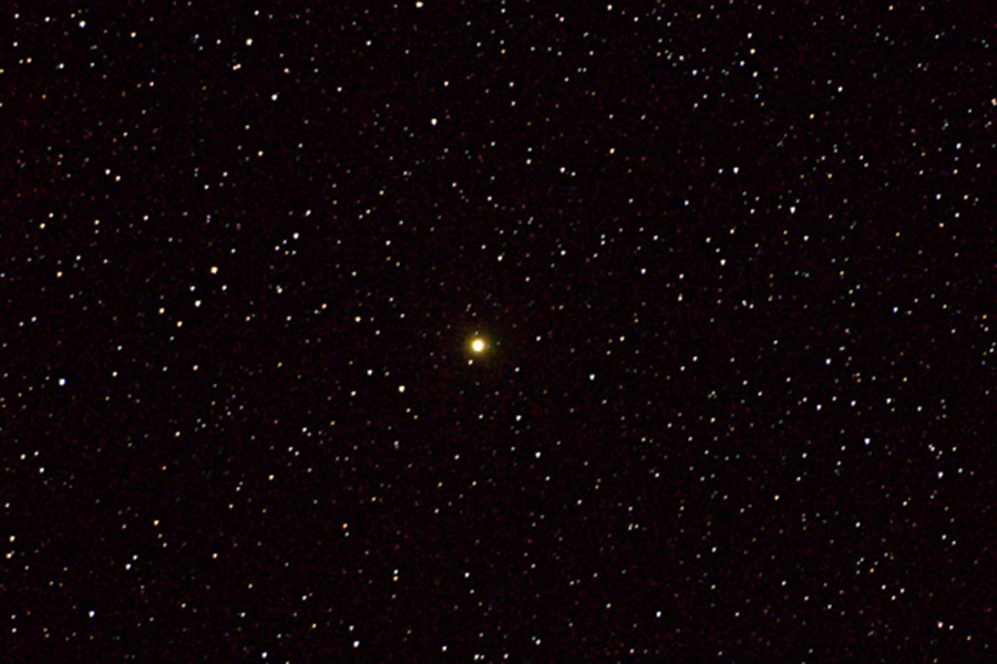 Orange star in star field