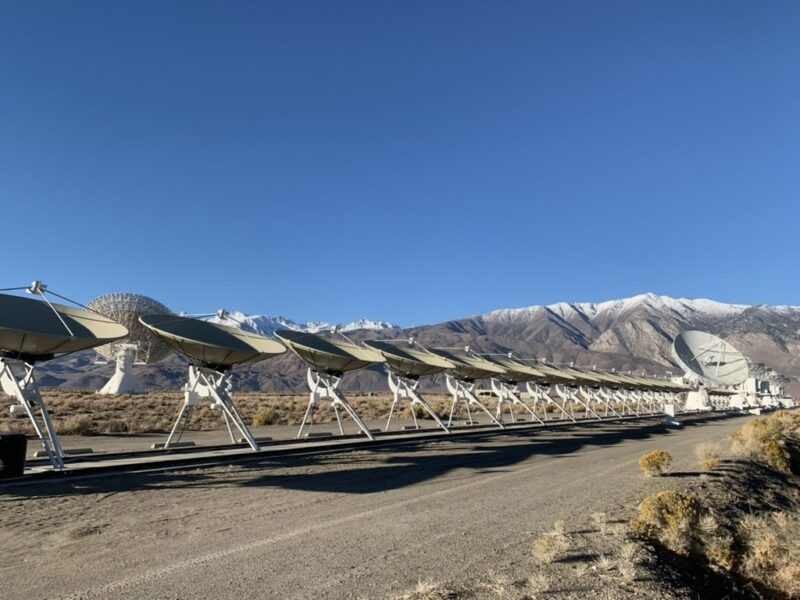 Dishes from the Deep Synoptic Array lined up along dirt road