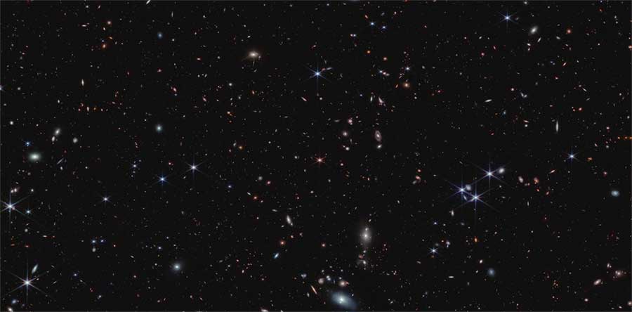 Field of galaxies with spiky "star" in the middle