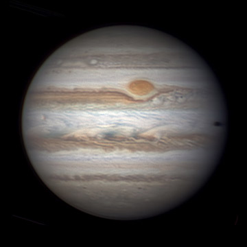 Jupiter on May 14th. South is up. Jupiter was (and still is) near eastern quadrature, 90° east of the Sun, so we see its celestial eastern side lit little less brightly than its western, slightly more Sun-facing side. The Great Red Spot still displays strong color, and the Red Spot Hollow has a dark line marking its northern edge. When Christopher Go shot this image at 10:56 UT, Europa was nearing Jupiter's preceding (celestial western) edge, and Io's shadow had just entered the following edge three minutes earlier.