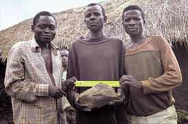 Men with 24 pound meteorite fragment
