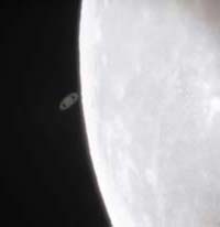 Saturn disappearing behind the Moon