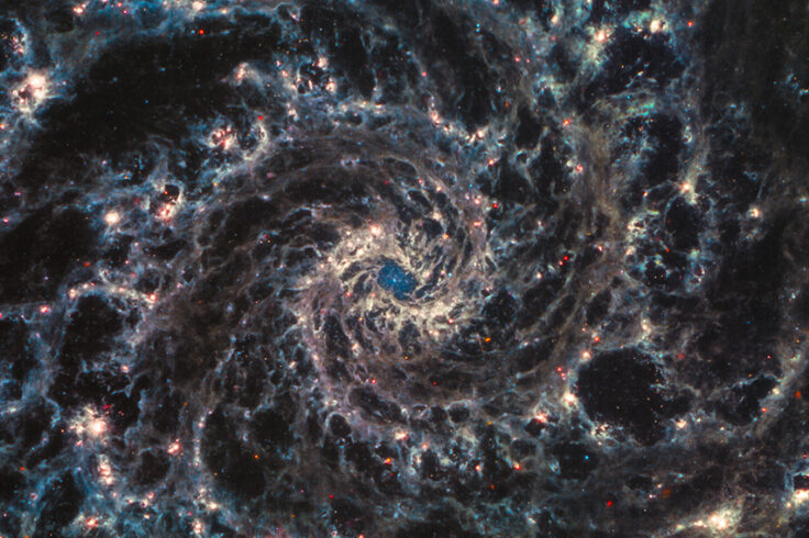 NGC 628 looks like a giant blue-gold maelstrom with a blue middle