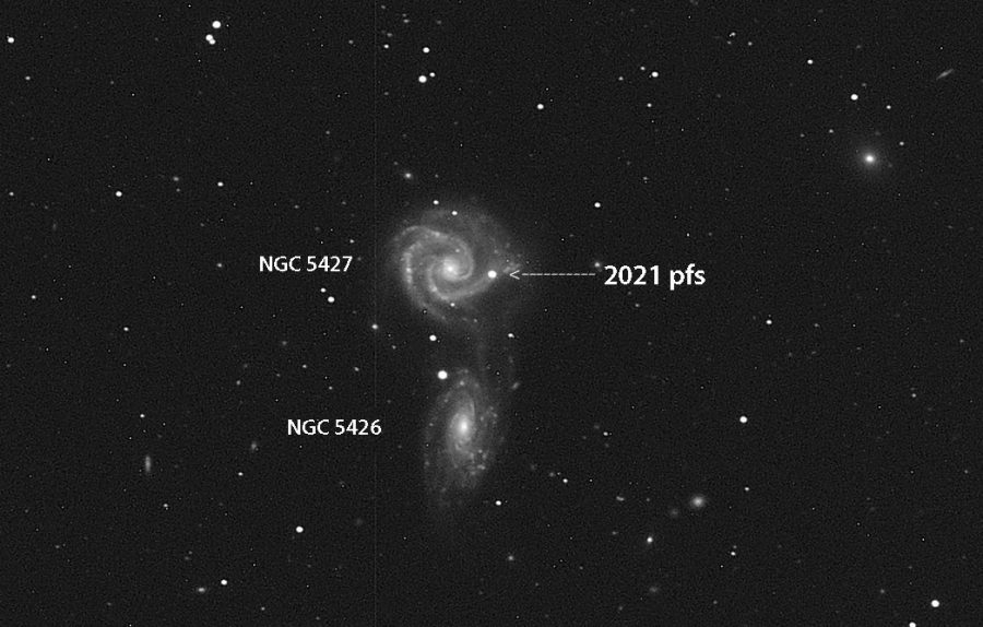 two galaxies, NGC 5427 and NGC 5426 shown interacting as 2021pfs is visible