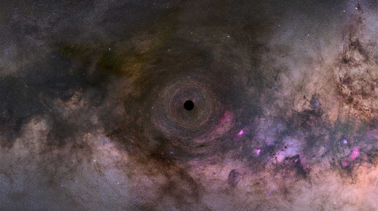 a black dot at the center of a swirl of pink, purple, orange, grey, and other colors
