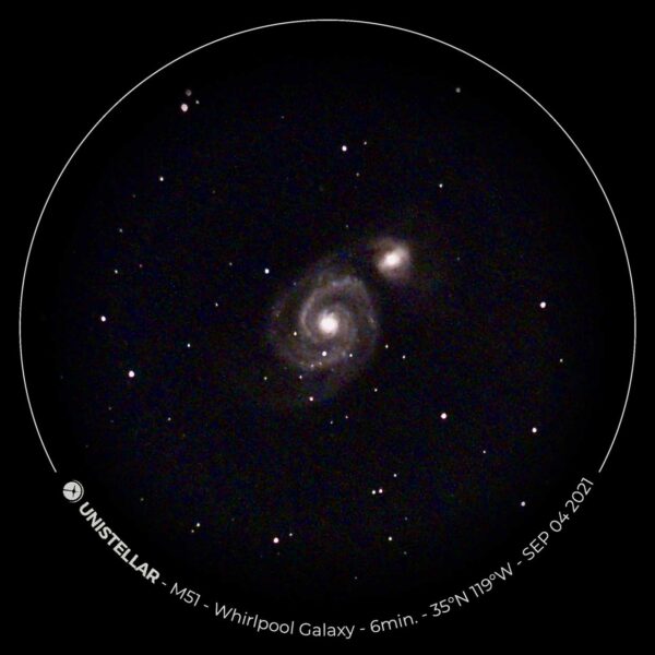 two small galaxies, one with a whirlpool formation around it, against a black background with white dots indicating stars