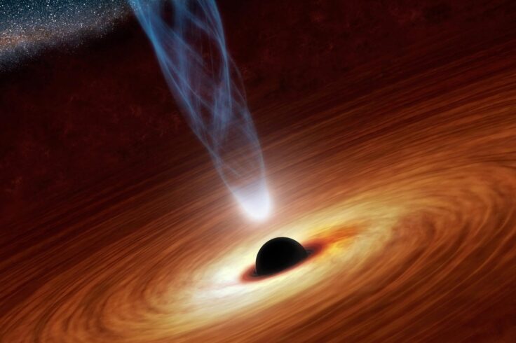 dark hole surrounded by hot disk of swirling gas and shooting out a jet from its rotation axis