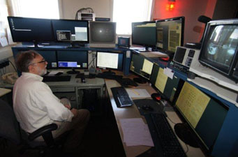 Bob McMillan at the controls of the Spacewatch telescopes