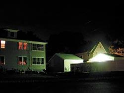 Harsh light spilling over onto neighboring buildings