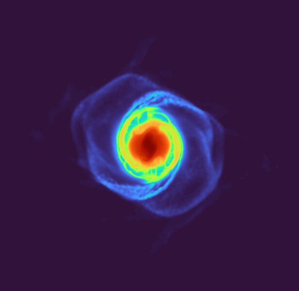 Red central blob is surrounded by yellow, green, and blue swirls, capturing a post-impact moment in the simulation.