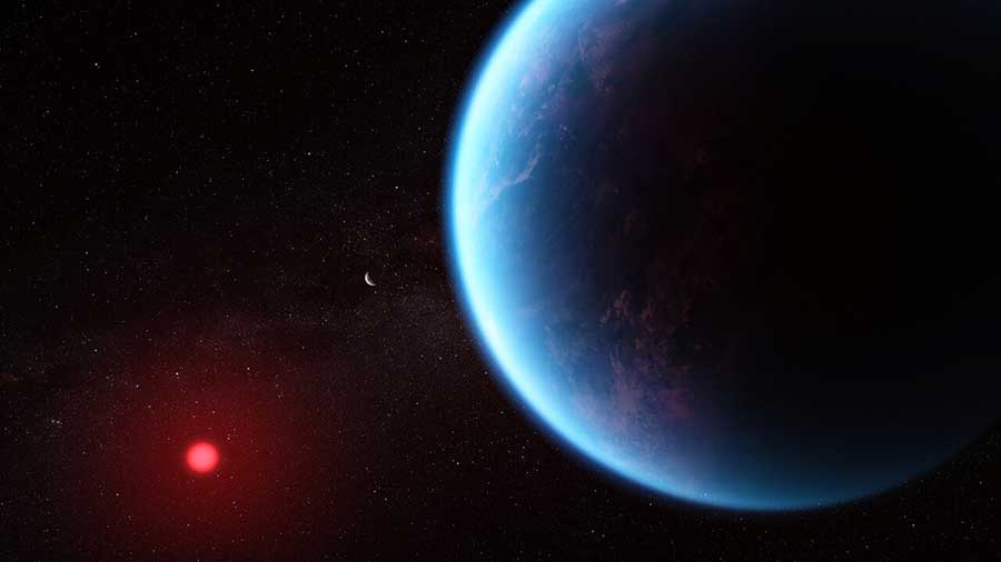Illustration of an exoplanet planet and its red cool dwarf star on a black background that is speckled with some small stars. The planet is large, in the foreground on the right and the star is smaller, in the background at the lower left. The planet is various shades of blue, with wisps of white scattered throughout. The left edge of the planet (the side facing the star) is lit, while the rest is in shadow. The star has a bright red glow