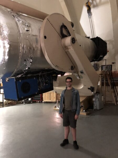 Bolin stands next to Oschin telescope