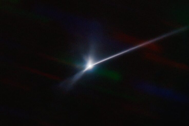 Trailing plume ejected from bright Dimorphos