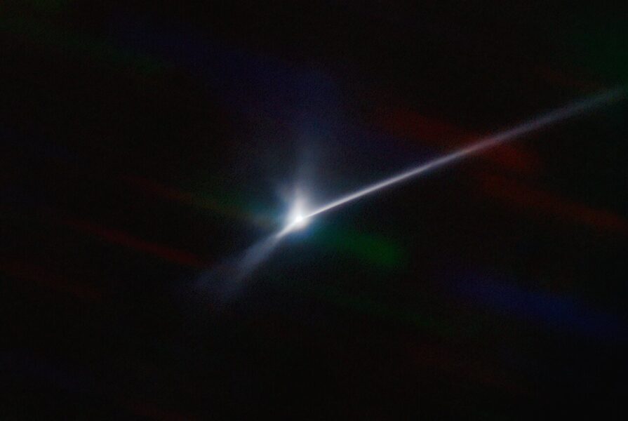 Trailing plume ejected from bright Dimorphos