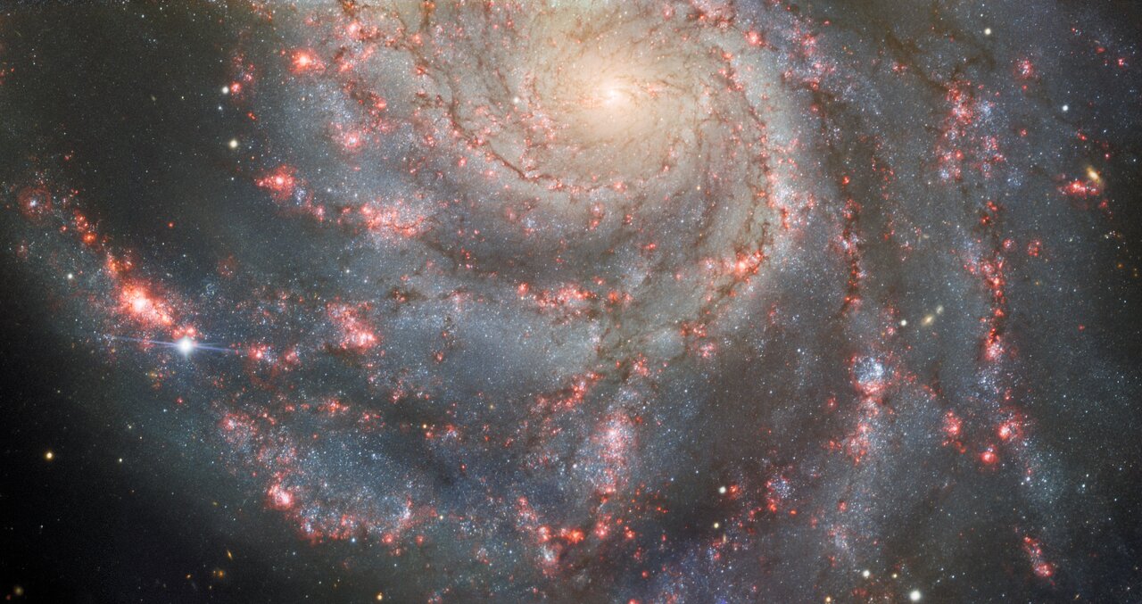 Spiral galaxy with sparkling diamond in on of its arms
