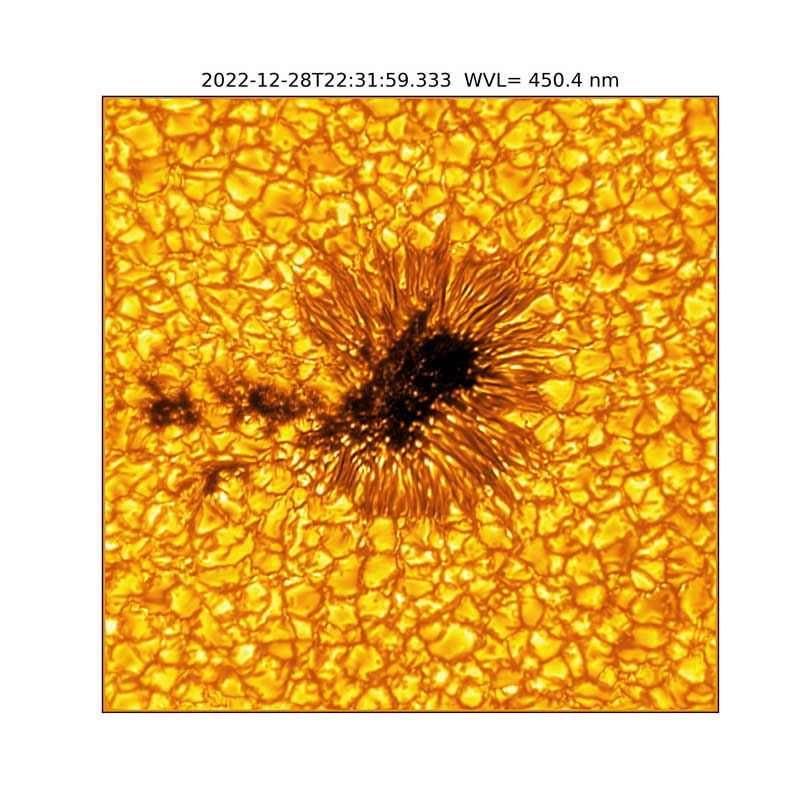 yelow image with dark spots and dark lines throughout like rocks or bubbles