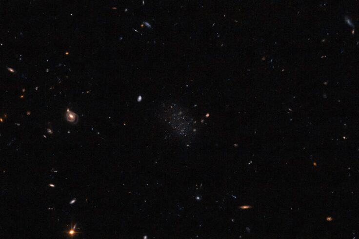 Donatiello II appears as a smattering of stars on a black field dotted with background galaxis