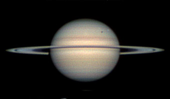 Saturn with Rhea and its shadow in transit, March 9, 2010