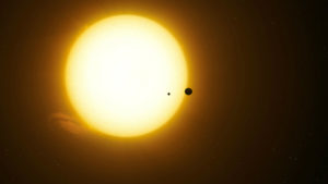 Illustration of Kepler-1625b and moon transiting star
