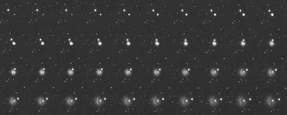 collection of still images showing a small white dot moving across a black background and dissolving into a plume of white dust