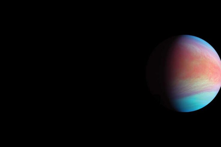 a blue and pink planet in half shadow against a black background