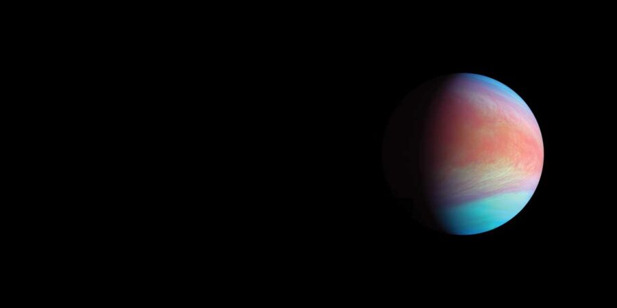 a blue and pink planet in half shadow against a black background